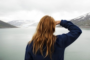 Woman Looking at a Glacier
