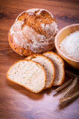 Freshly baked bread on wooden table