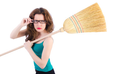 Young woman with broom on white