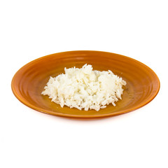 White rice on porcelain plate isolated over white background