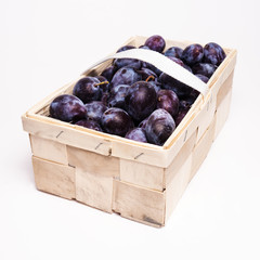 plums in basket