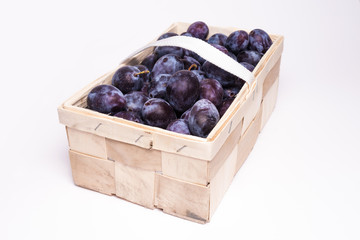 plums in basket