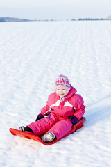 Fototapeta na wymiar little girl with bob in snow