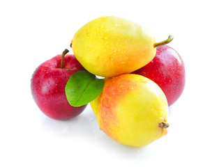 Ripe yellow pears and red apples on a white background
