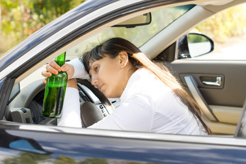 Naklejka premium Drunk alcoholic female driver