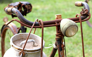 Rusty milkman's bike with aluminium drum and lights