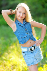 portrait of little girl outdoors in summer