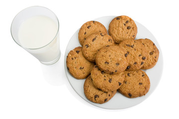 Chocolate chip cookies and a glass of milk isolated on white