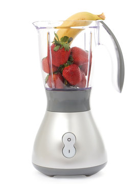 Blender with strawberries and bananas isolated
