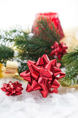 Christmas composition with gift bow, ribbon and branch of christ