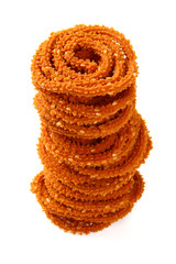 Traditional indian snack - chakali, isolated on white.