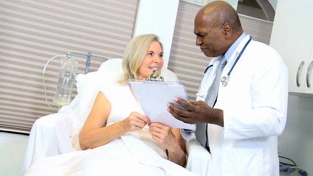 Male African American Doctor Treating Hospital Patient 