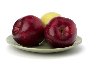 Apples pile on plate