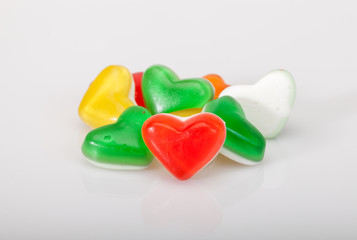 colorful heart shaped candies on white