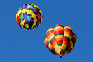 hot air balloons against blue sky