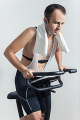 Fototapeta premium Man exercising on stationary bike