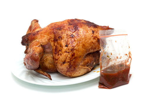 grilled chicken on a plate on a white background