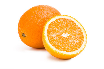 Close up of two oranges and one is cut, isolated