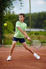 Fototapeta na wymiar Child playing tennis
