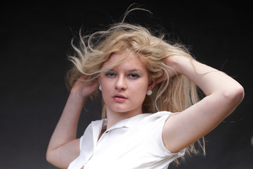 Blonde woman with her hair blowing