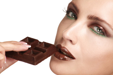 close up of a beautiful model tasting dark chocolate - 56563910
