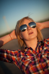 portrait of freckled blonde outside