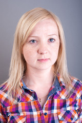 Studio portrait of freckled blonde