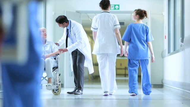 Hospital Corridor Busy With Staff Patients