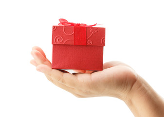 female hand holding red gift box on white background