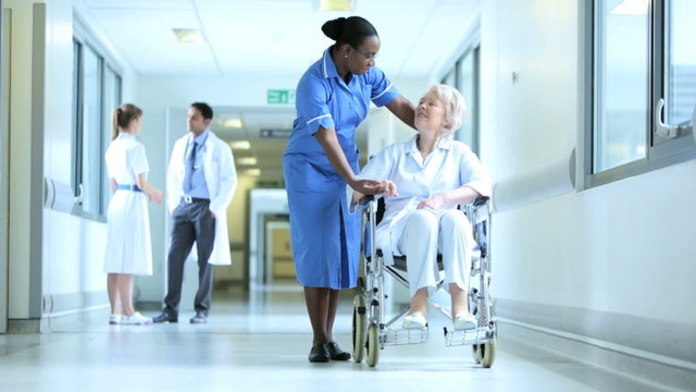 Hospital Corridor Busy With Staff Patients
