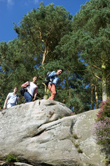 Group Of Young Men Hiking In Countryside