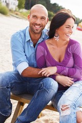 Happy smiling middle-aged couple on a beach