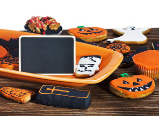 Halloween cookies and black sign for the congratulatory text