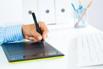 close-up of a man's hand with a pen stylus