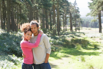 Romantic Young Couple Walking In Countryside