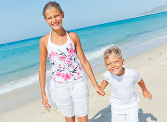 Cute boy and girl on the beach