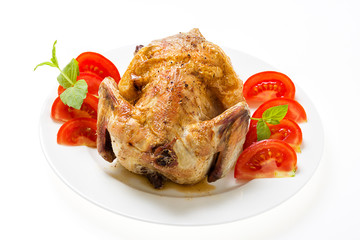 fried chicken with vegetables on the ceramic plate