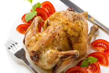 fried chicken with vegetables on the ceramic plate