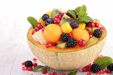 fruit salad with melon,blackberries,pomegranate and mango