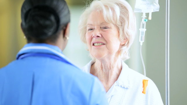 Caring African American Nursing Staff Older Female Patient
