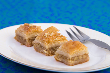 Three Pieces of Golden Color Walnut Baklava