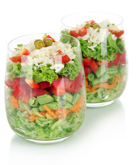 Tasty salad with fresh vegetables, isolated on white