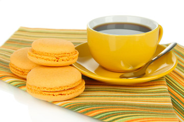 Coffee and macaroons isolated on white