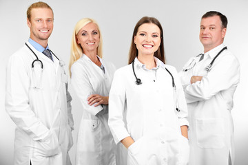 Fototapeta premium Medical workers on grey background