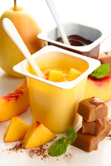 Composition with tasty desserts, pieces of fresh fruits and