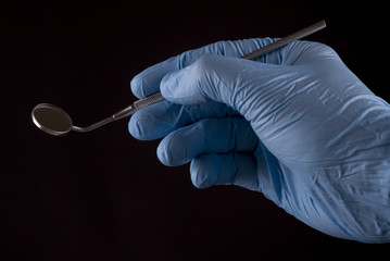 Dentist with angled mirror