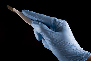 Surgeon Holding a Scalpel