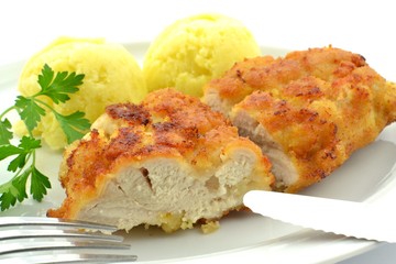 fried chicken breast fillet with potatoes