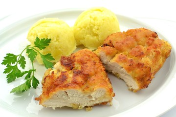 fried chicken breast fillet with potatoes