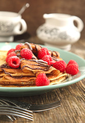 Crepes with fresh raspberry and powder sugar